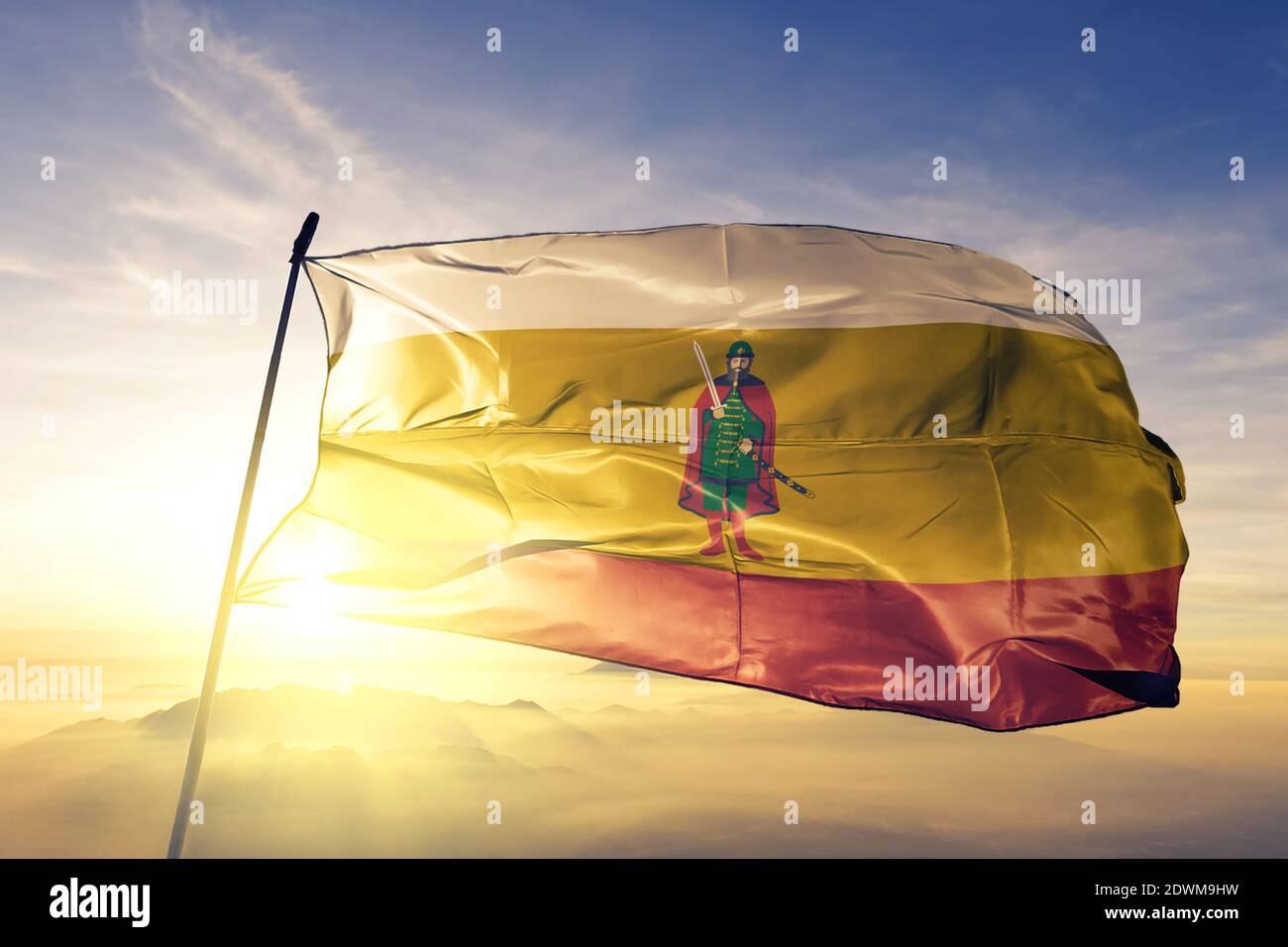 Ryazan oblast of Russia flag waving on the top sunrise mist fog Stock Photo