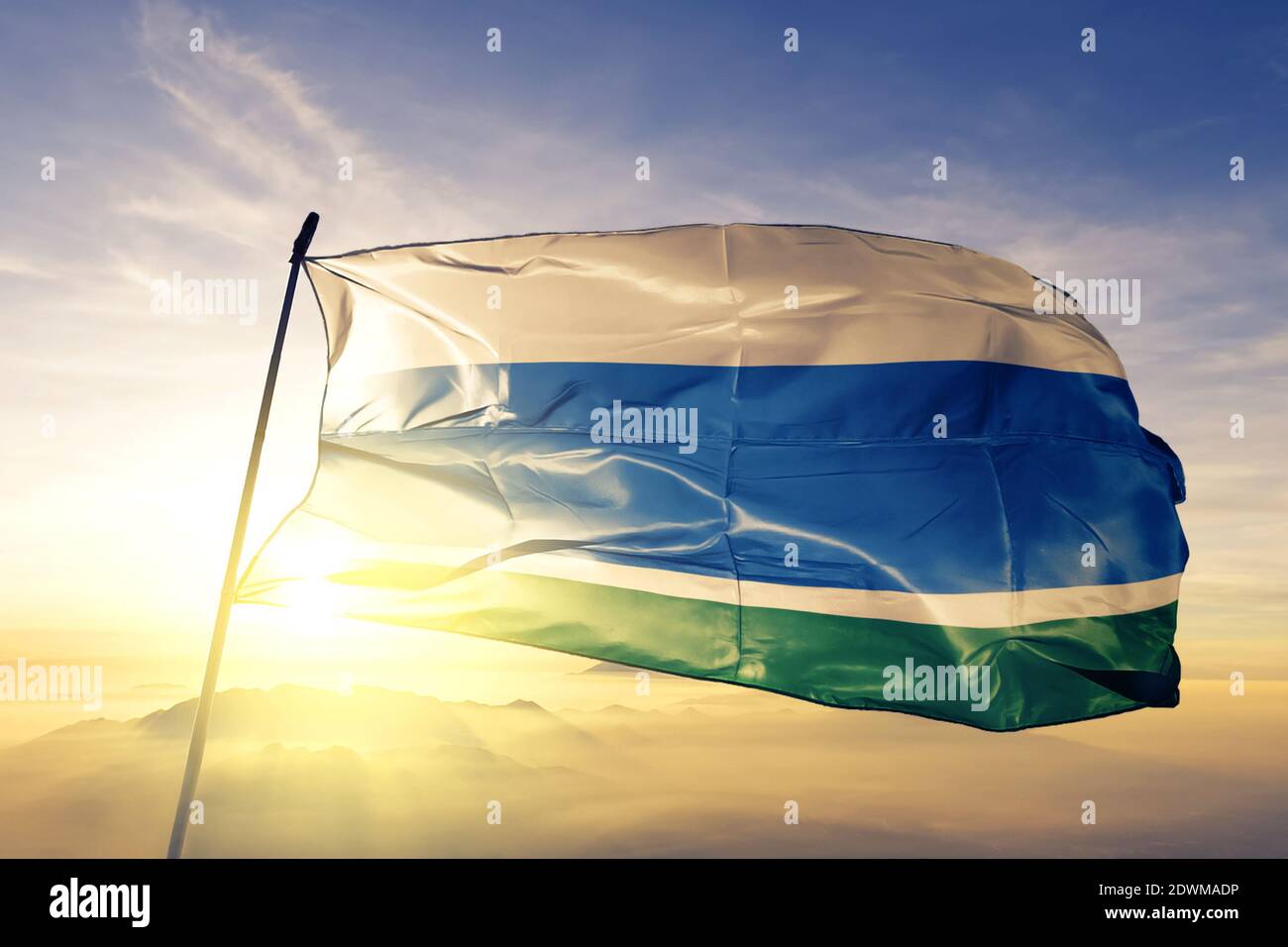 Sverdlovsk oblast of Russia flag waving on the top sunrise mist fog Stock Photo