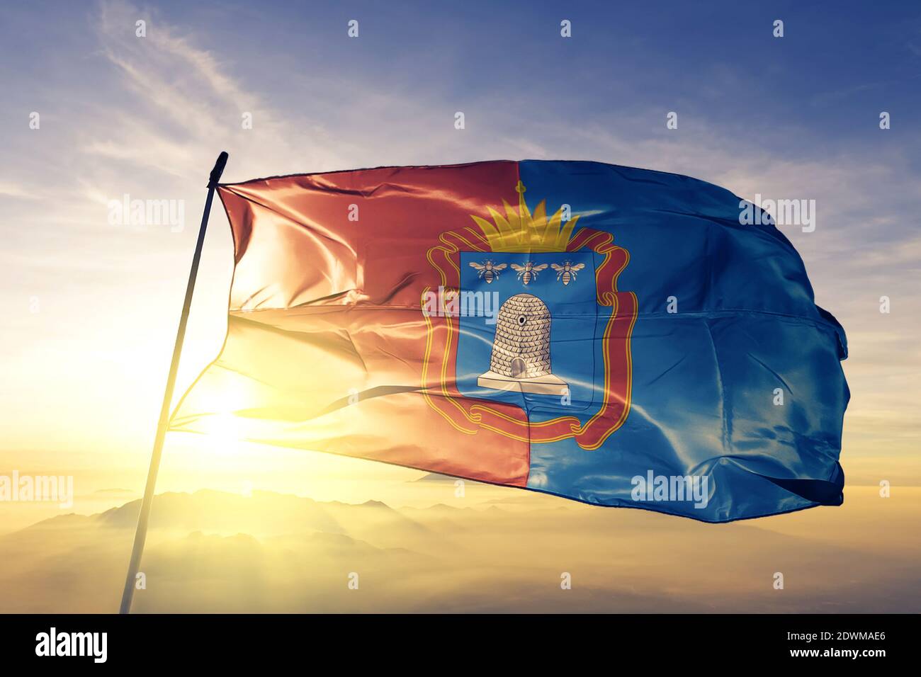 Tambov oblast of Russia flag waving on the top sunrise mist fog Stock Photo