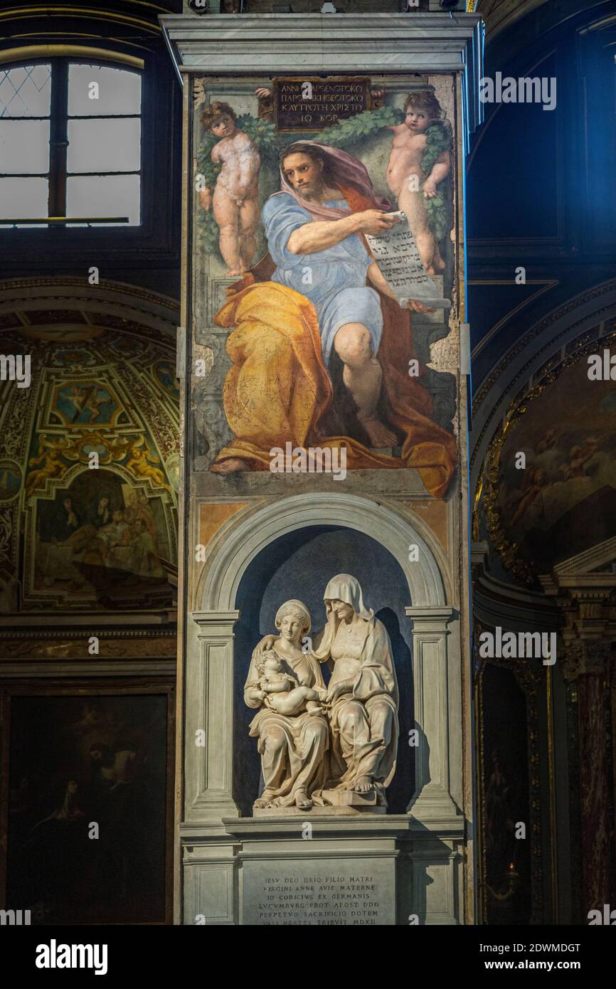 The marble group of Saint Anne and the Virgin and the fresco by Raffaelo Sansio dedicated to the prophet Isaiah. Church of Sant'Agostino, Rome, Italy Stock Photo