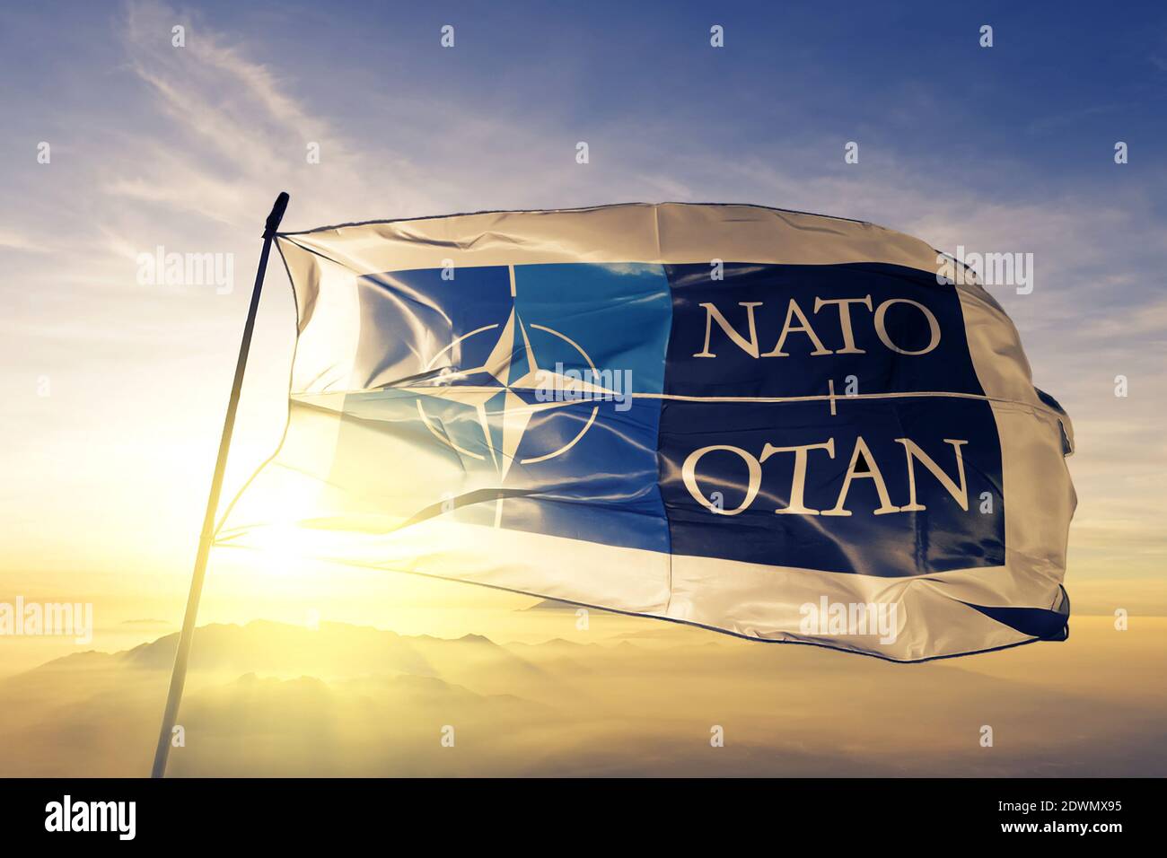 North Atlantic Treaty Organization NATO OTAN logo flag waving on the top Stock Photo