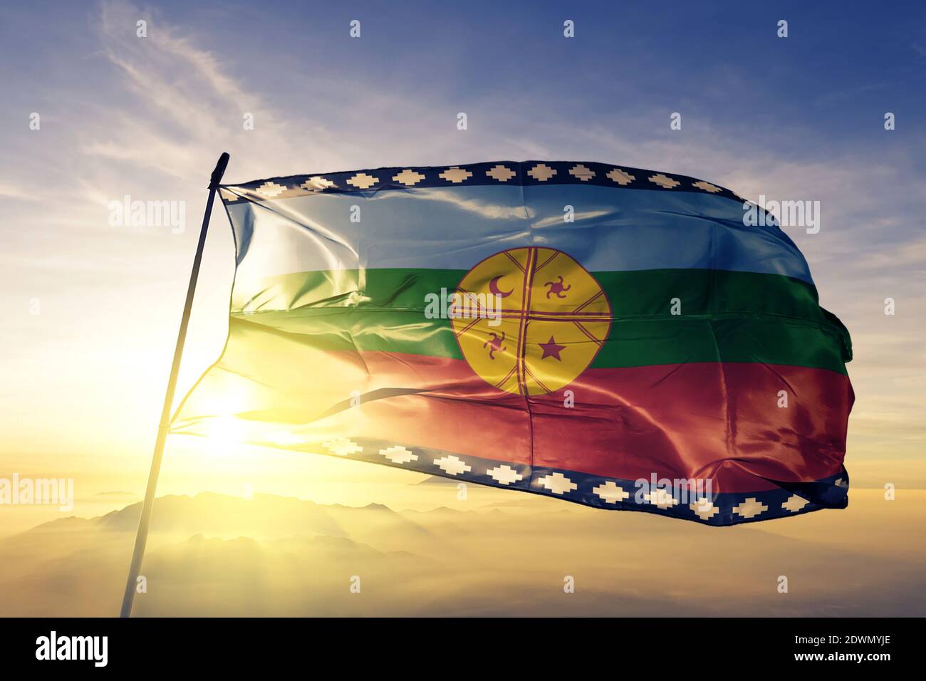 Mapuche flag waving on the top sunrise mist fog Stock Photo