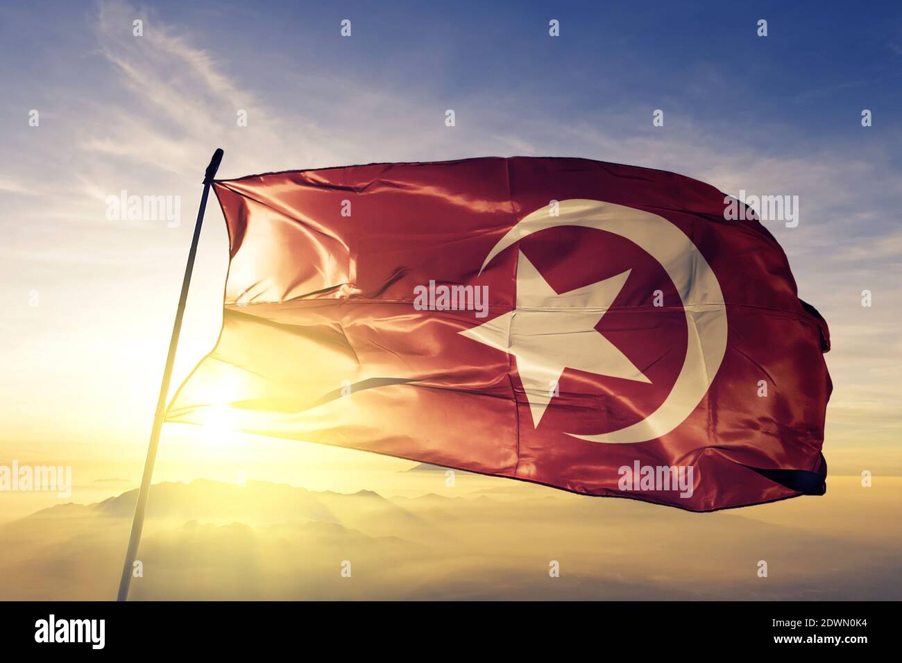 Nation of Islam flag waving on the top sunrise mist fog Stock Photo Alamy