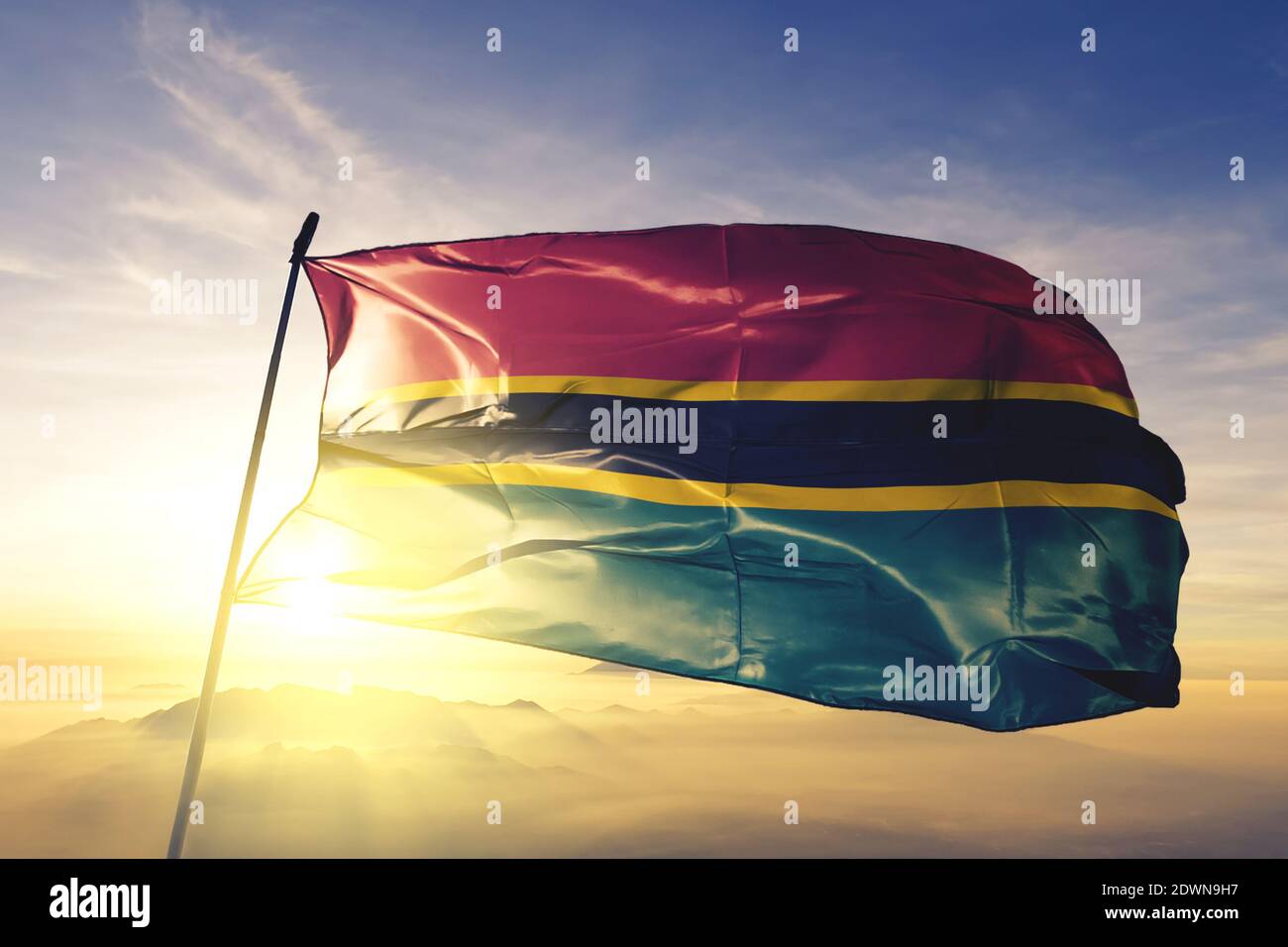 Volta region of Ghana flag waving on the top sunrise mist fog Stock Photo