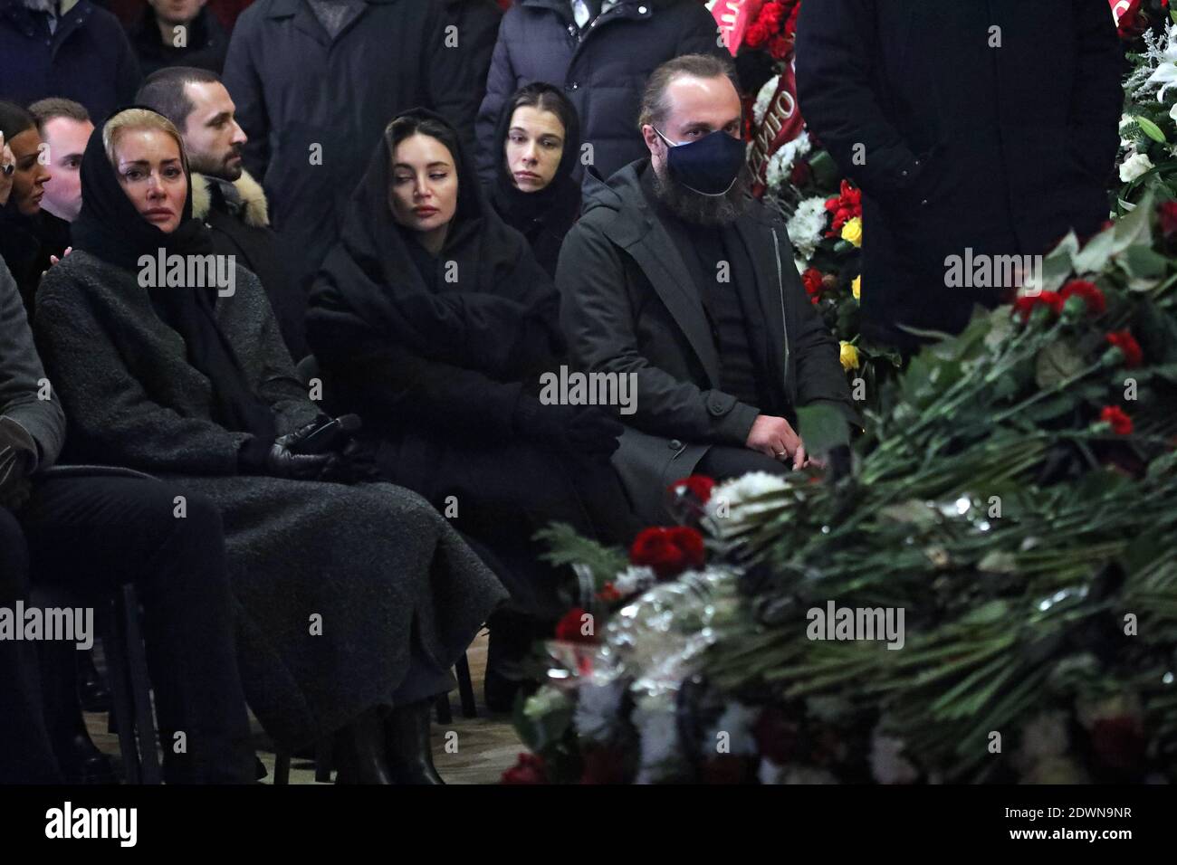 Non Exclusive: KHARKIV, UKRAINE - DECEMBER 23, 2020 - Widow Oksana Haisinska (L) is pictured during the funeral ceremony of her husband, late Kharkiv Stock Photo