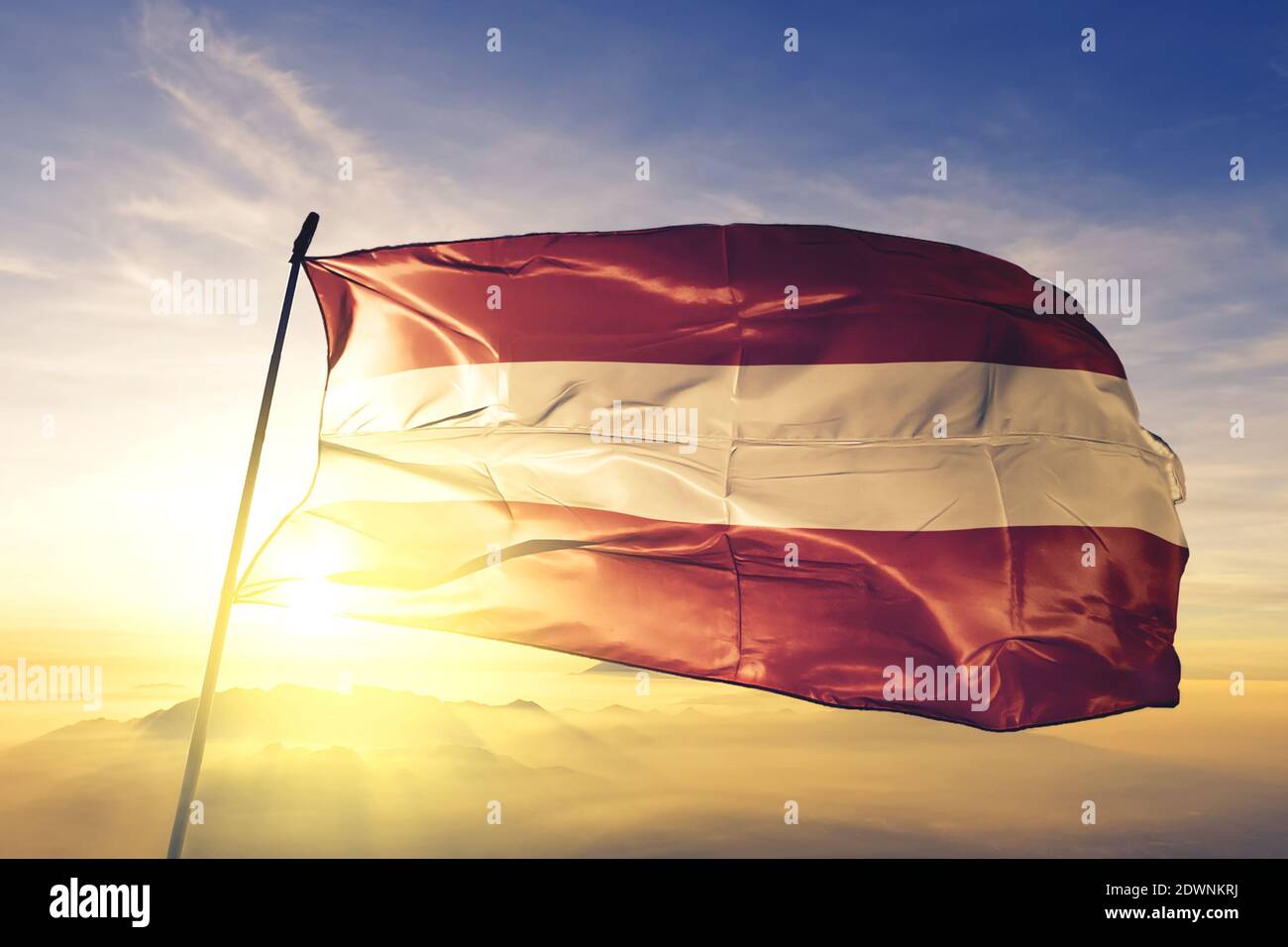 Leuven of Flemish Brabant of Belgium flag waving on the top sunrise mist fog Stock Photo