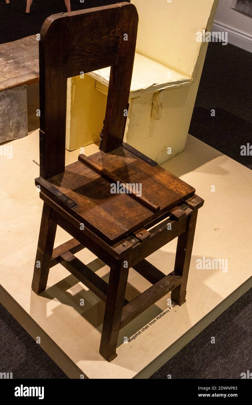 Mugshot chair (with ridge to discourage movement) from Holloway Prison, on display in the National Justice Museum, Nottingham, Notts, UK. Stock Photo