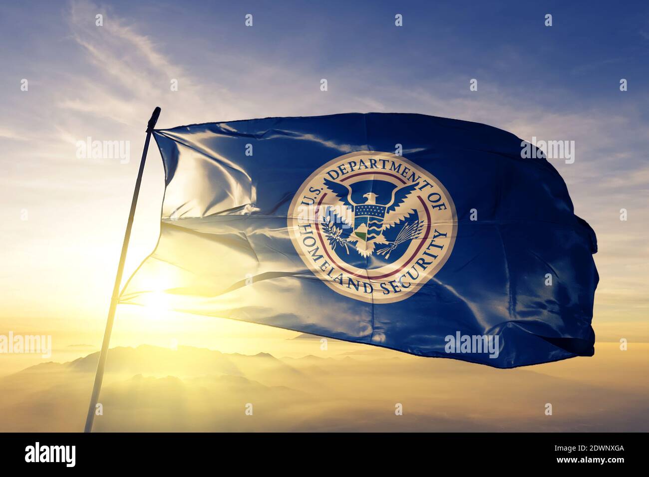 United States Department of Homeland Security flag waving sunrise mist fog Stock Photo