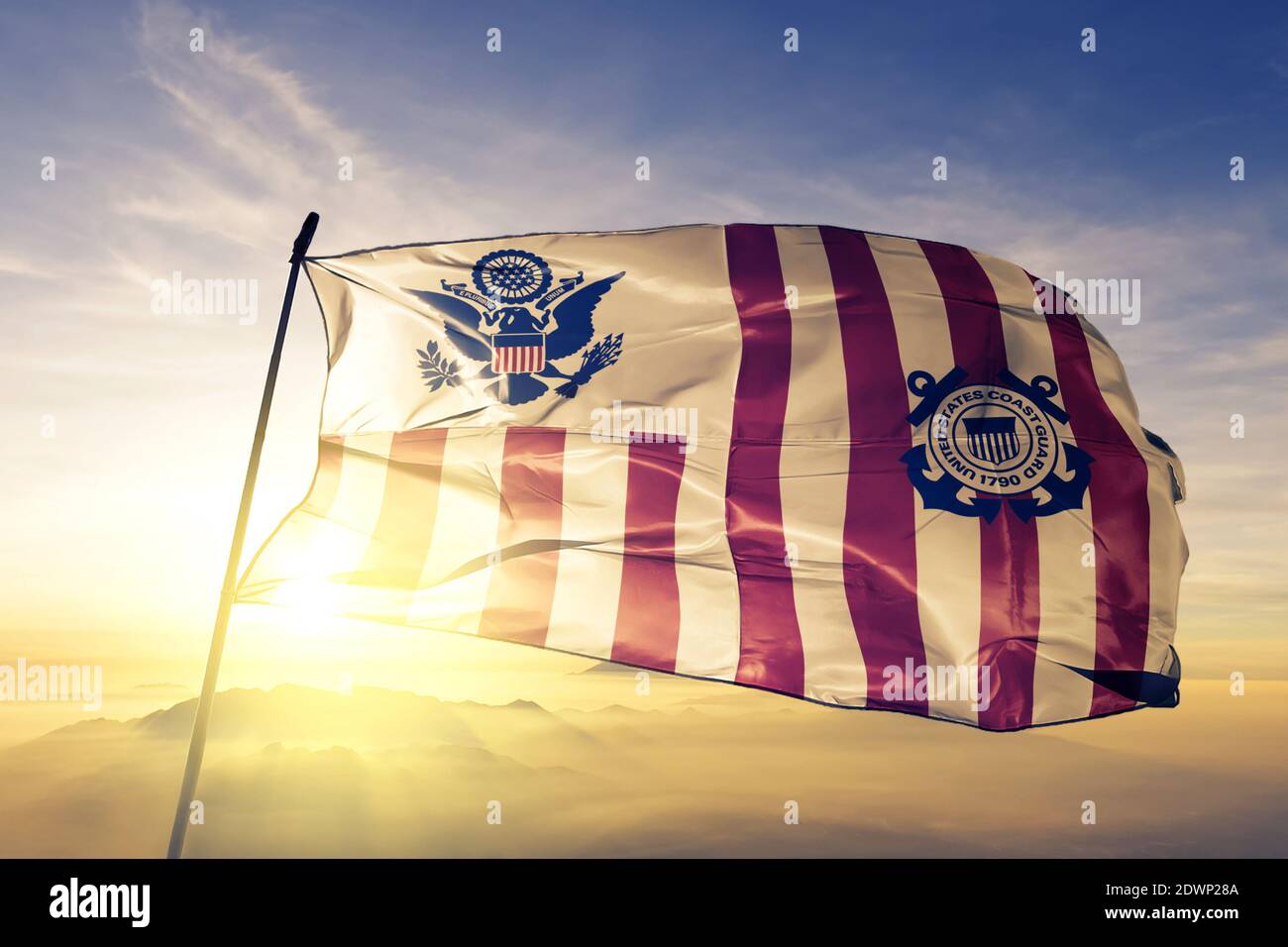 United States Marine Corps flag waving on the top sunrise mist fog