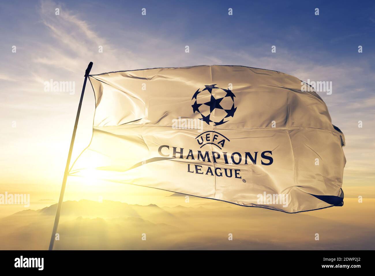 UEFA Champions League logo flag waving on the top sunrise mist fog Stock Photo