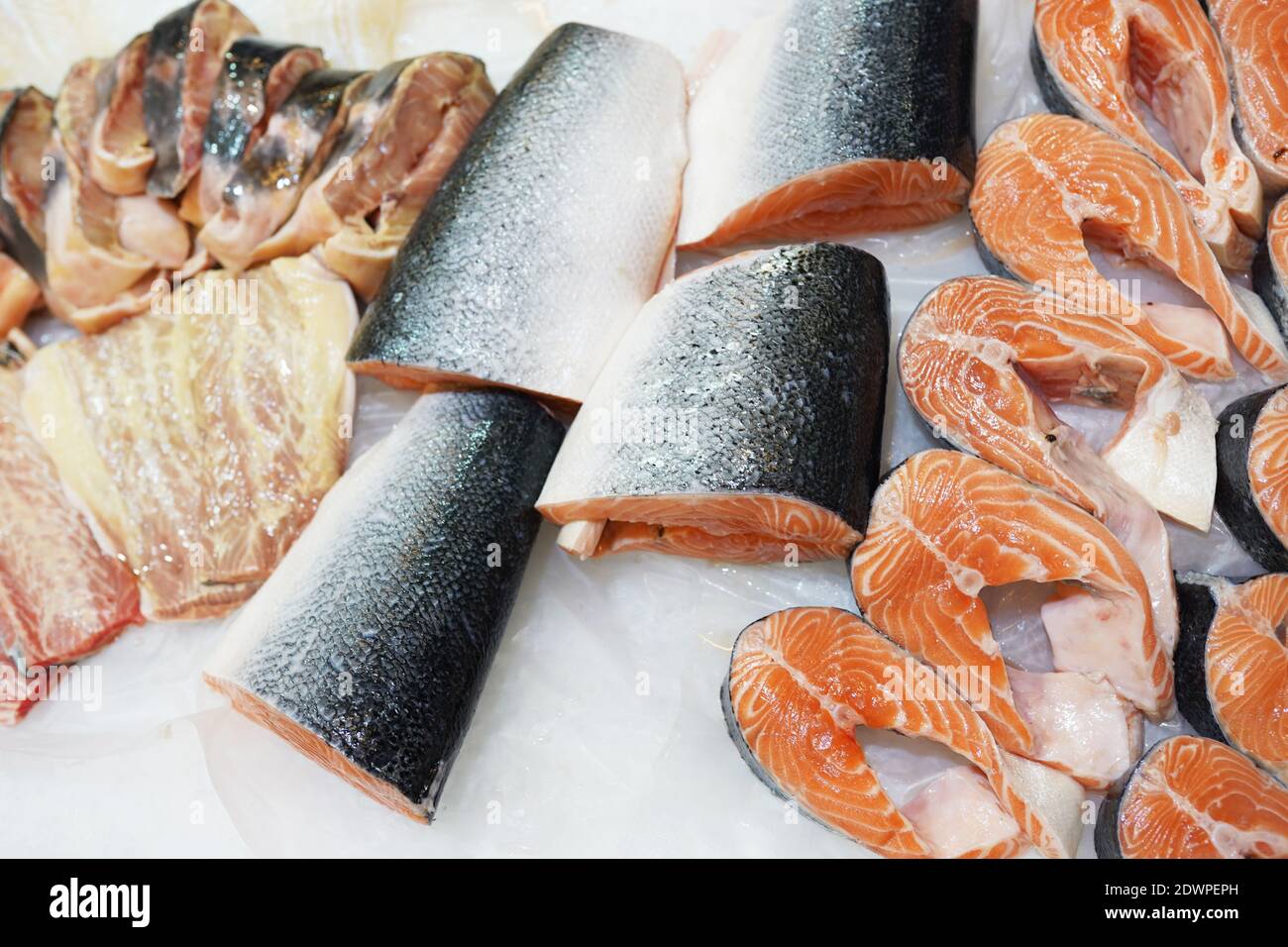 Salmon on cooled market display, tm's removed from price tags Stock Photo
