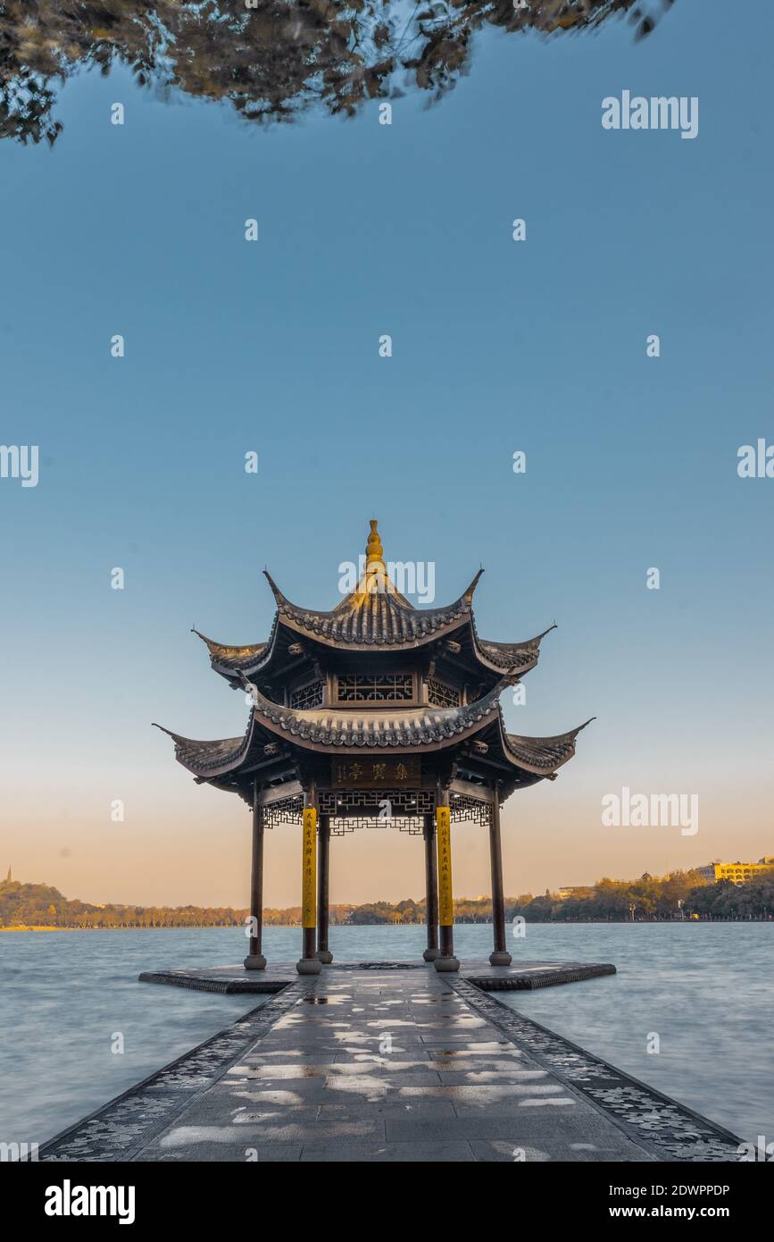 Sunrise view of Jixian pavilion, the historic landmark in at West Lake, in Hangzhou, China. Stock Photo