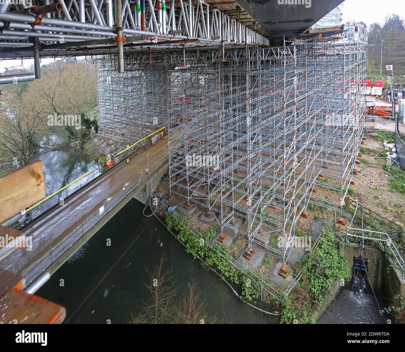 Scaffolding beneath the M25 motorway Gade Valley Viaduct, Kings Langley, UK. Providing access for strengthening work to the steel beams. Stock Photo
