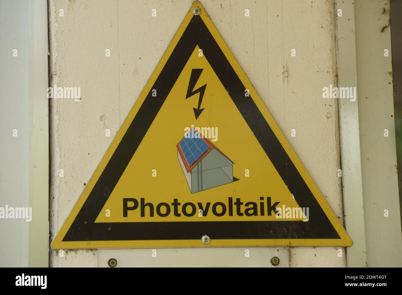 a building and photovoltaics sign, sustainable and ecological energy production Stock Photo
