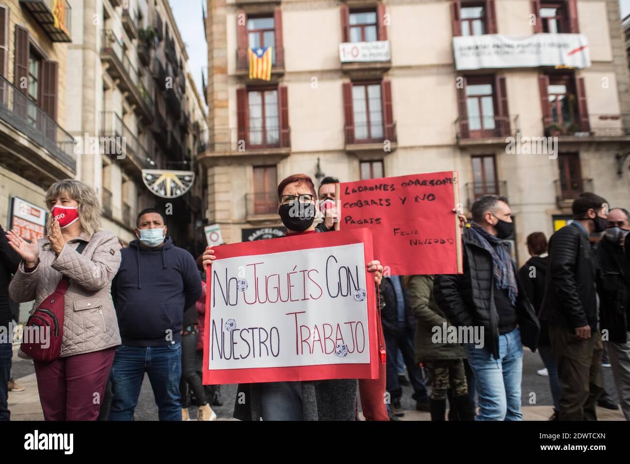 Barcelona, Catalonia, Spain. 23rd Dec, 2020. Protester is seen with placard  that says, don't play with our work.Workers of Bingo and Casino of  Catalonia protest in Barcelona this Wednesday, December 23, for