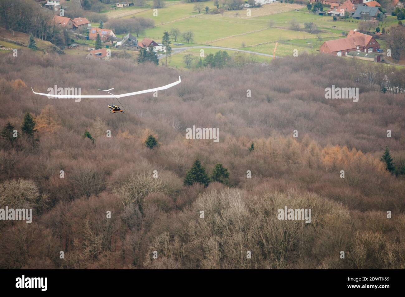 Hang glider in the air on a sunny day. Stock Photo