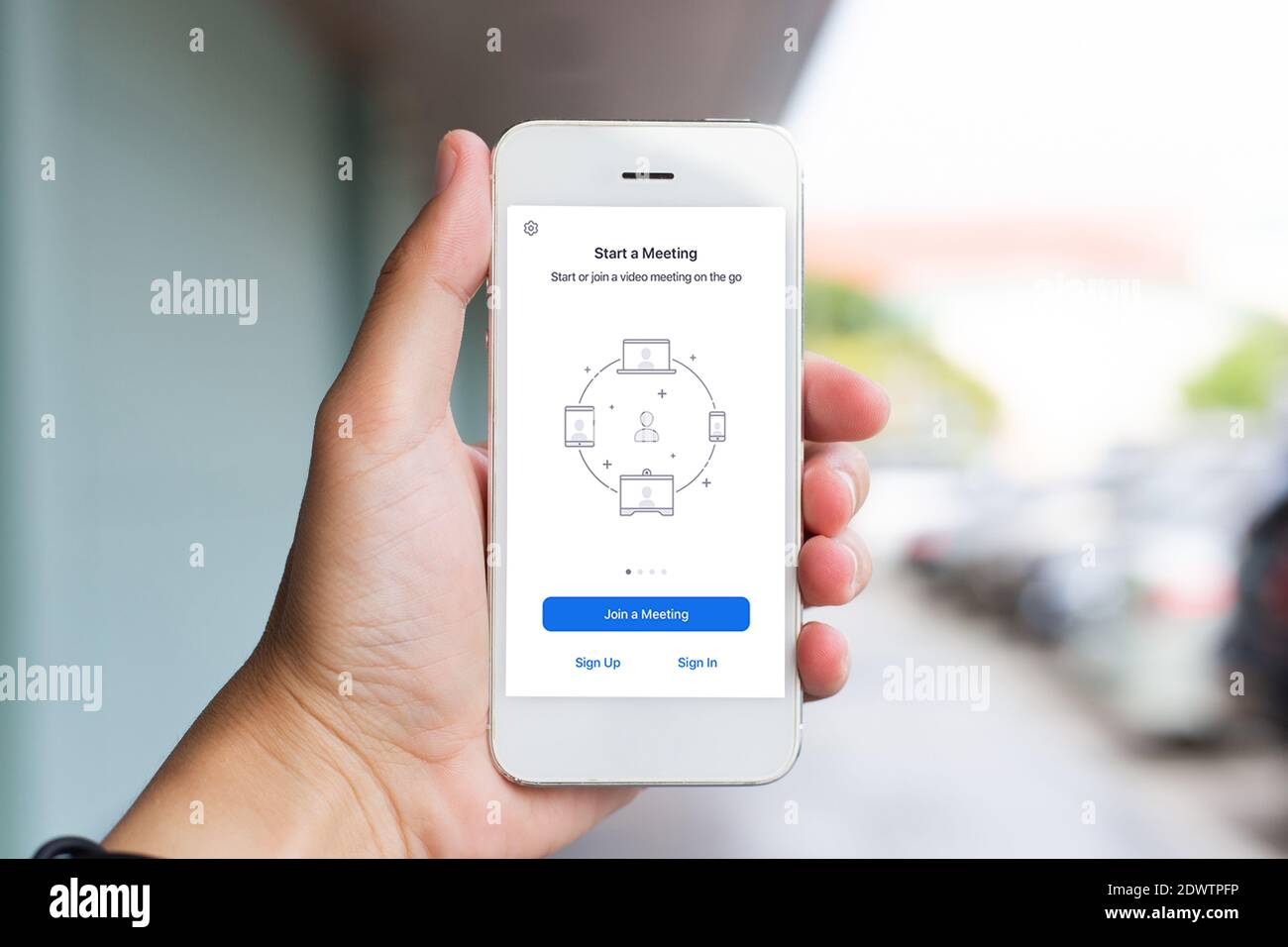 Close Up A Young Man Using A Smartphone To Login Into Zoom Meeting Call Stock Photo Alamy