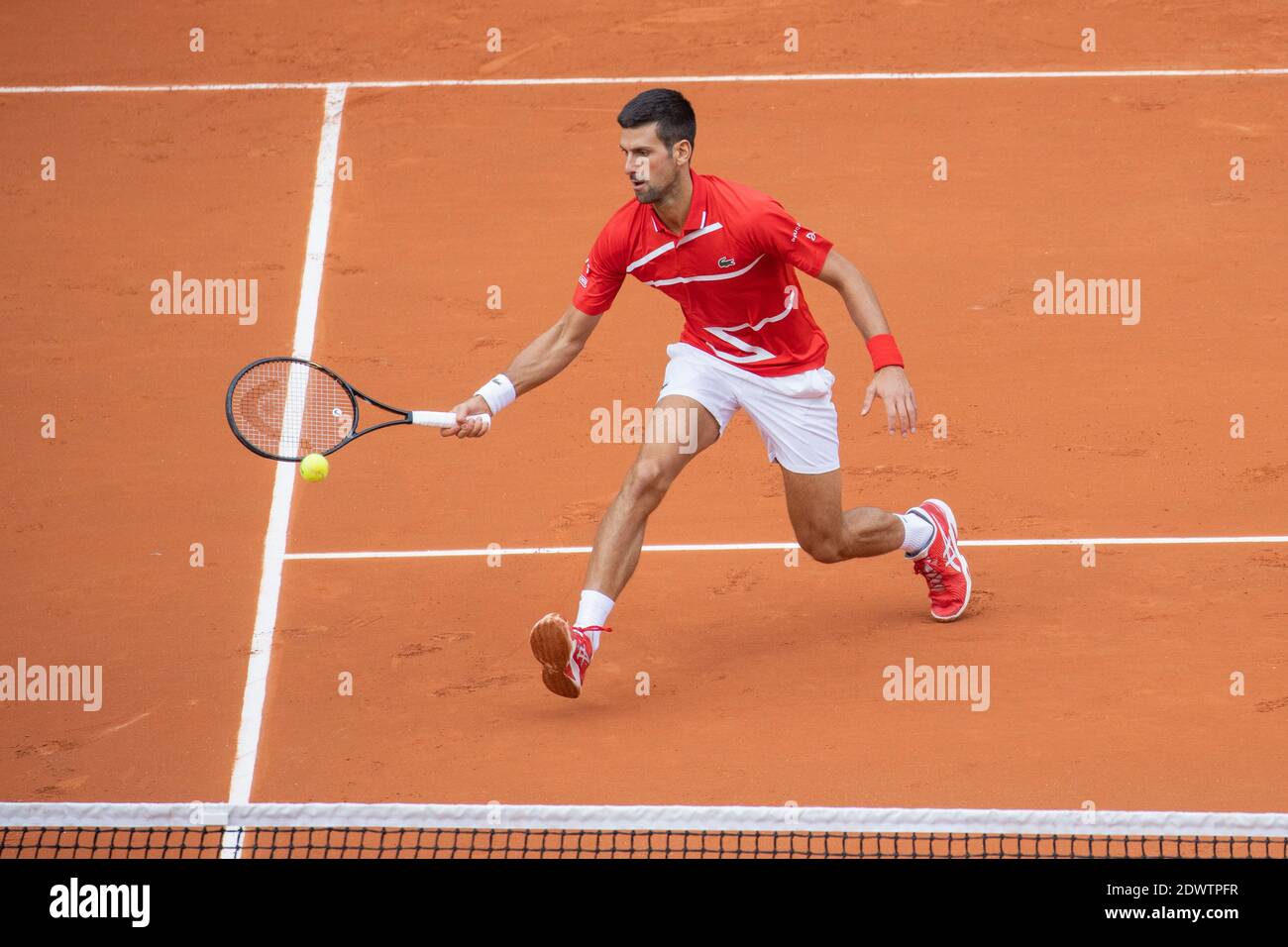Serbian tennis player Novak Djokovic playing a forehand volley at French Open 2020, Paris, France, Europe. Stock Photo
