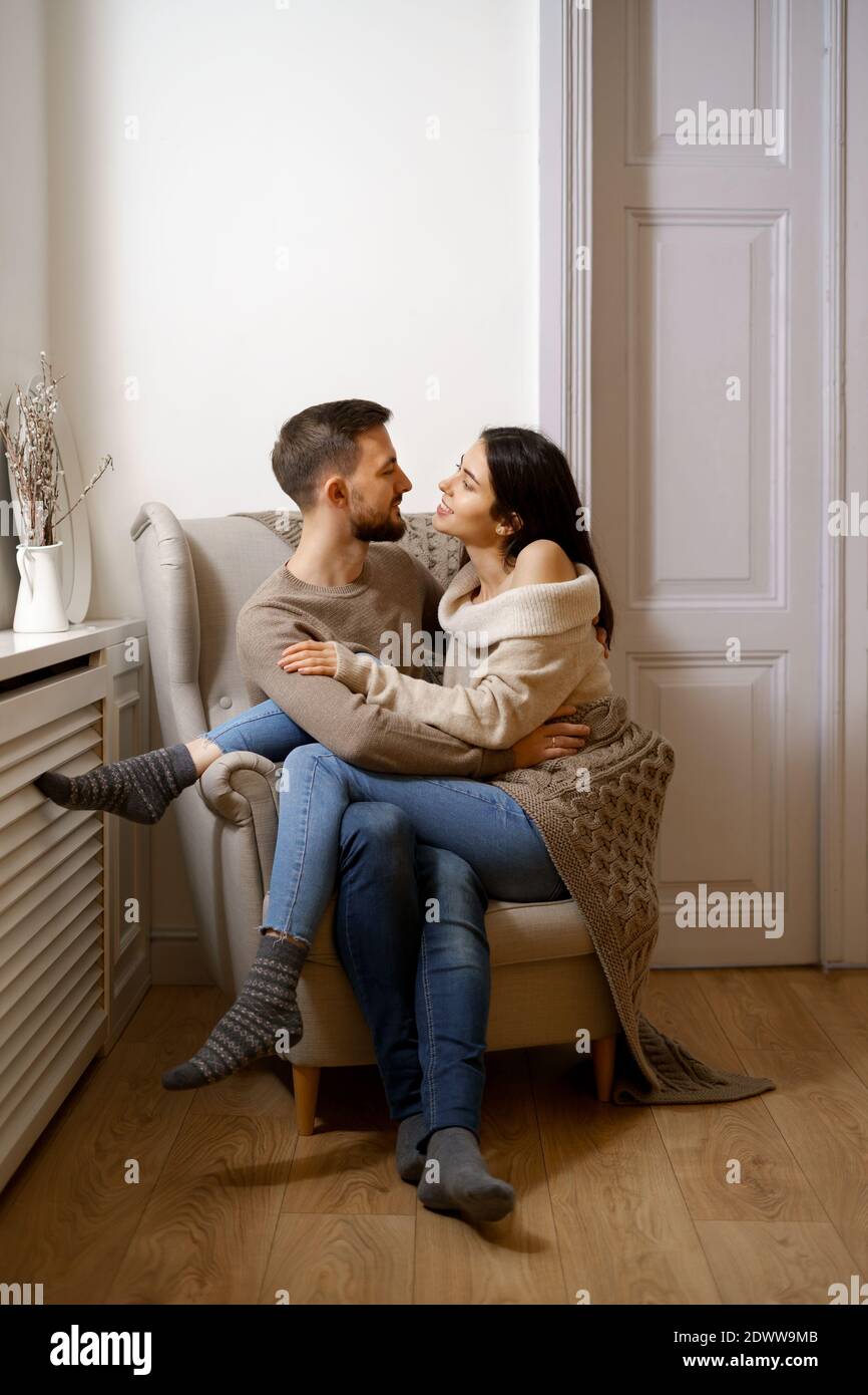 Romantic couple at home. An Attractive young woman and handsome ...