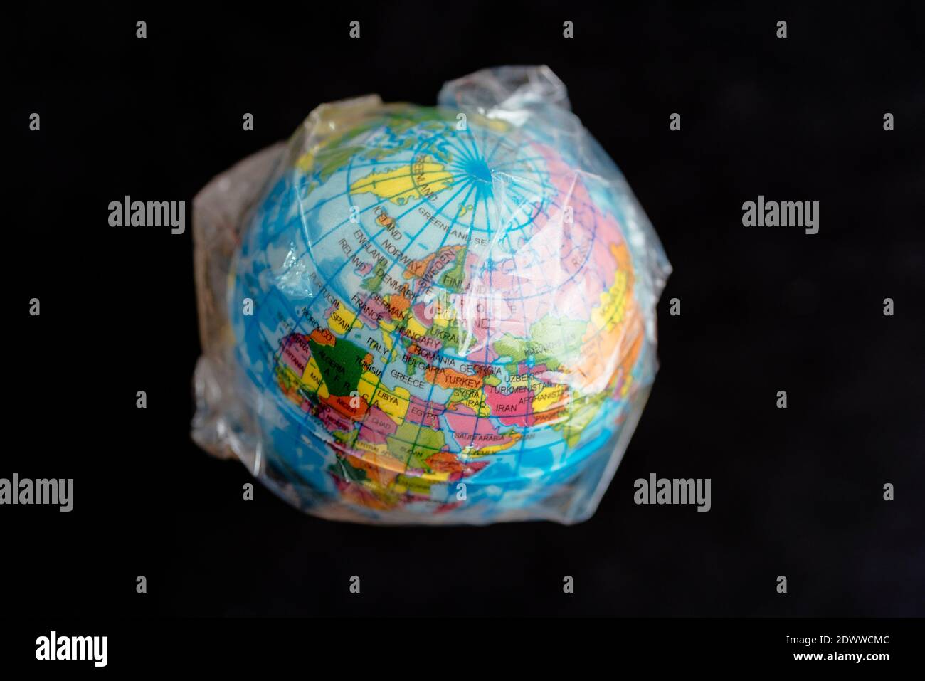 Globe of planet earth wrapped in plastic Stock Photo