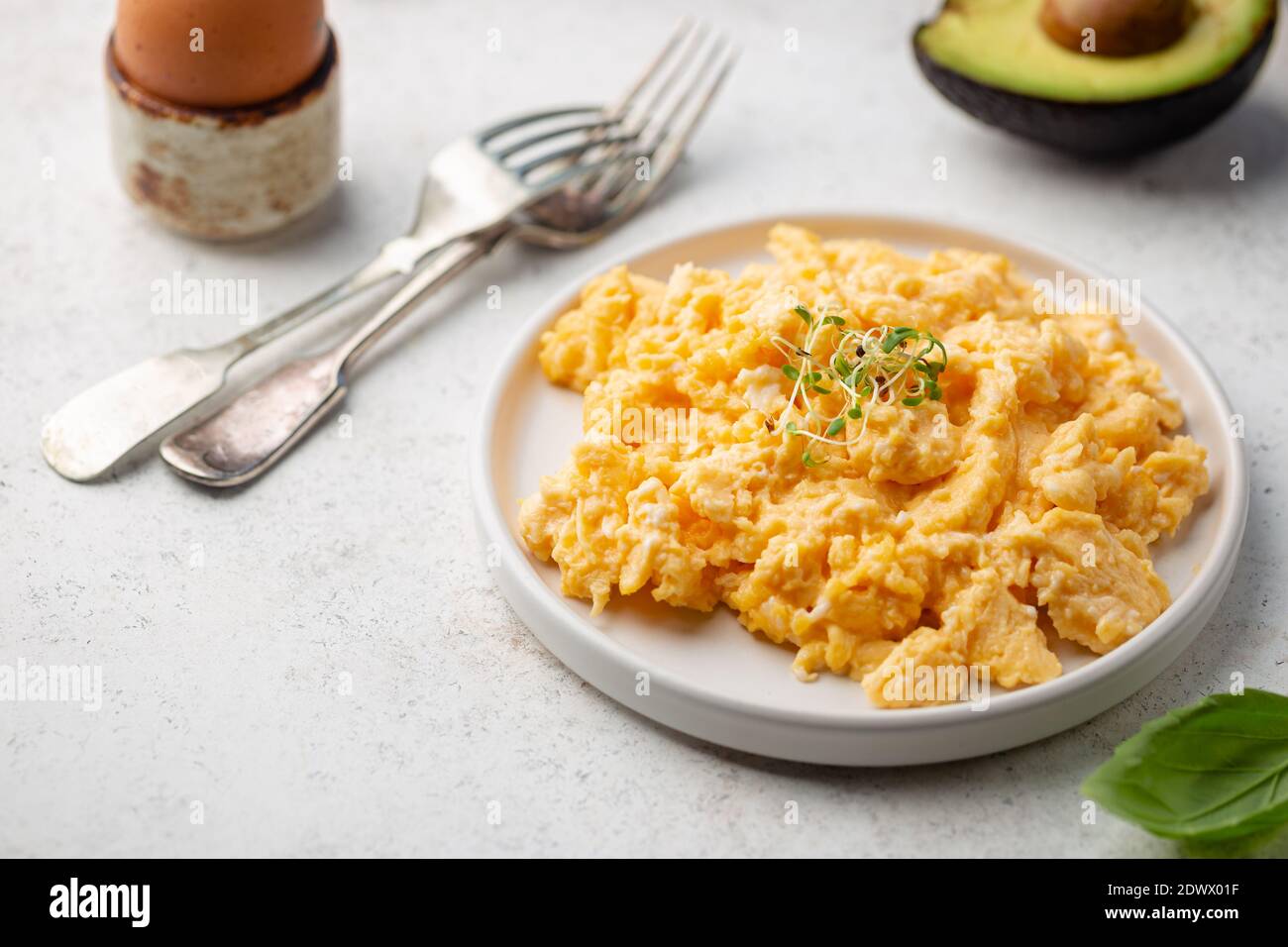 Fresh cooked scrambled eggs in a plate on white background Stock Photo ...