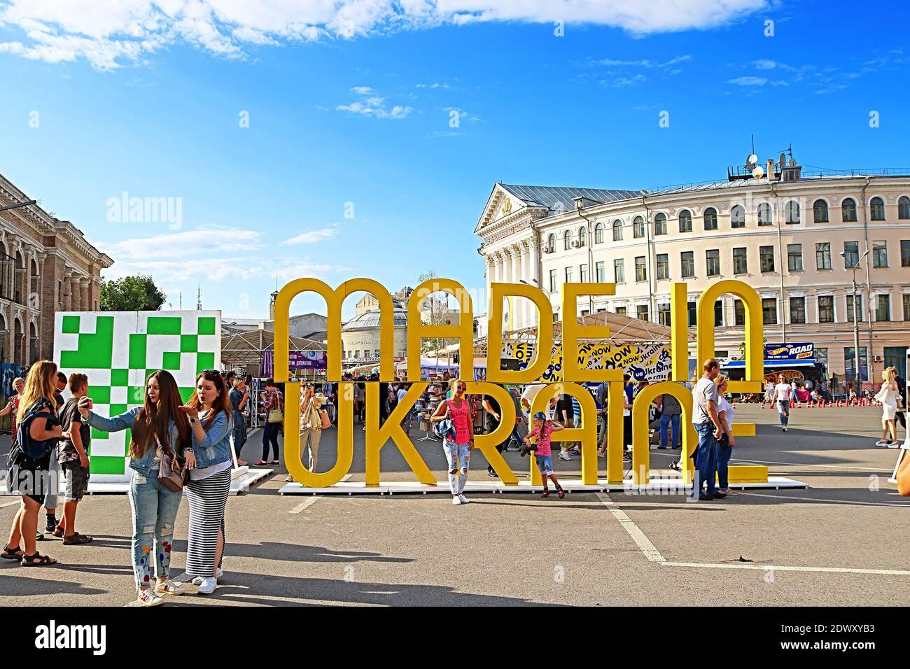 KYIV, UKRAINE - JULY 13, 2019: People at the fair near title MADE IN UKRAINE, a street market festival at the weekend, crafts fairs Stock Photo