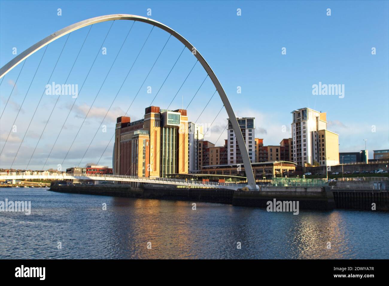 The Gateshead Millennium Bridge spans the River Tyne from Newcastle to the old Baltic Flour Mill building. Stock Photo