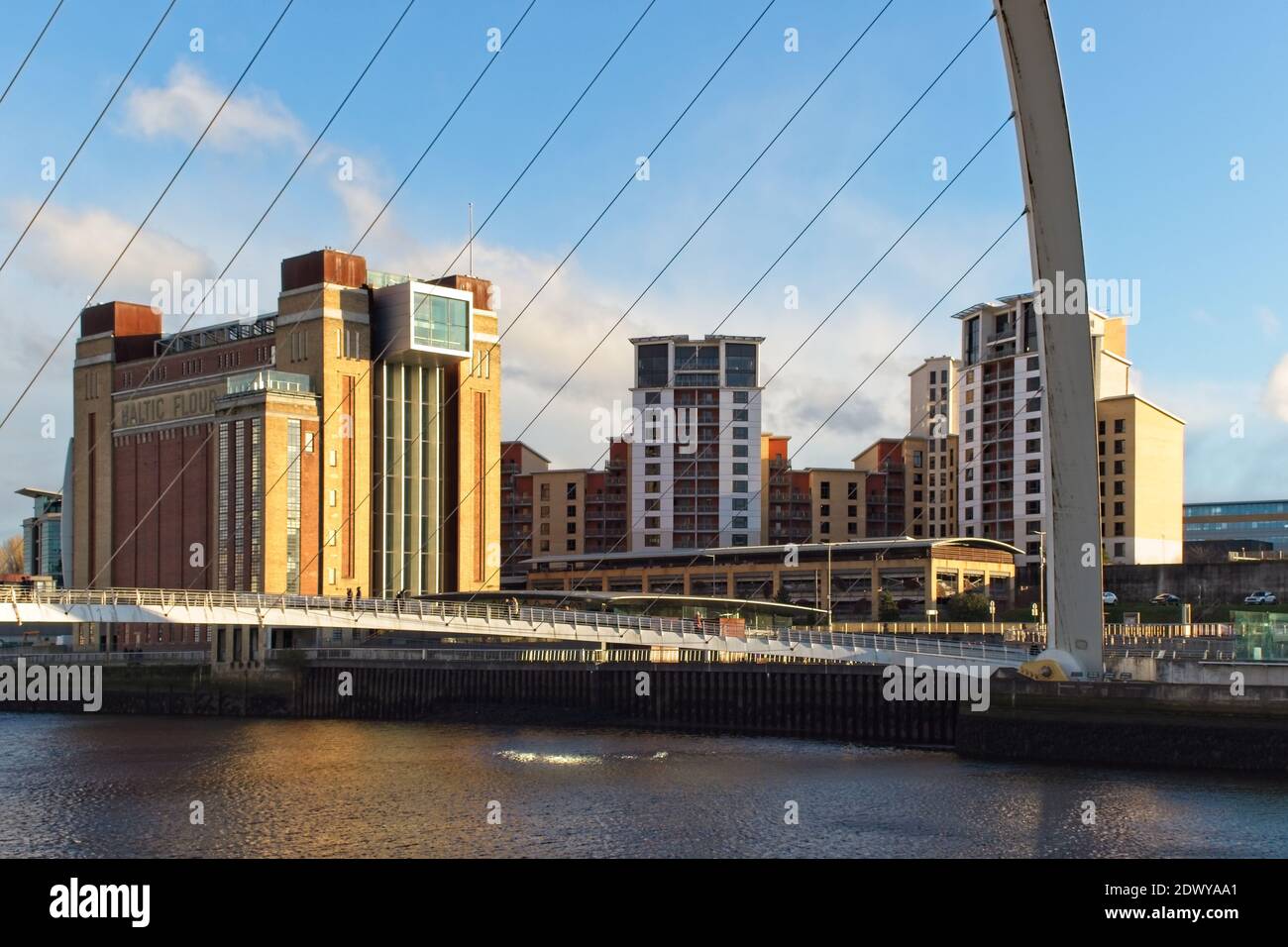 The Gateshead Millennium Bridge spans the River Tyne from Newcastle to the old Baltic Flour Mill building. Stock Photo