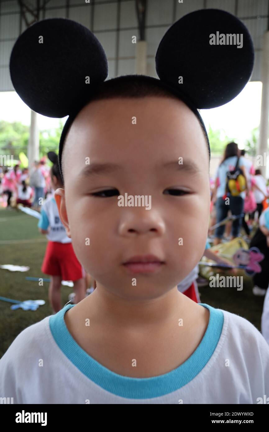 Portrait Of Cute Boy Wearing Ear Headband During Traditional Festival Stock Photo