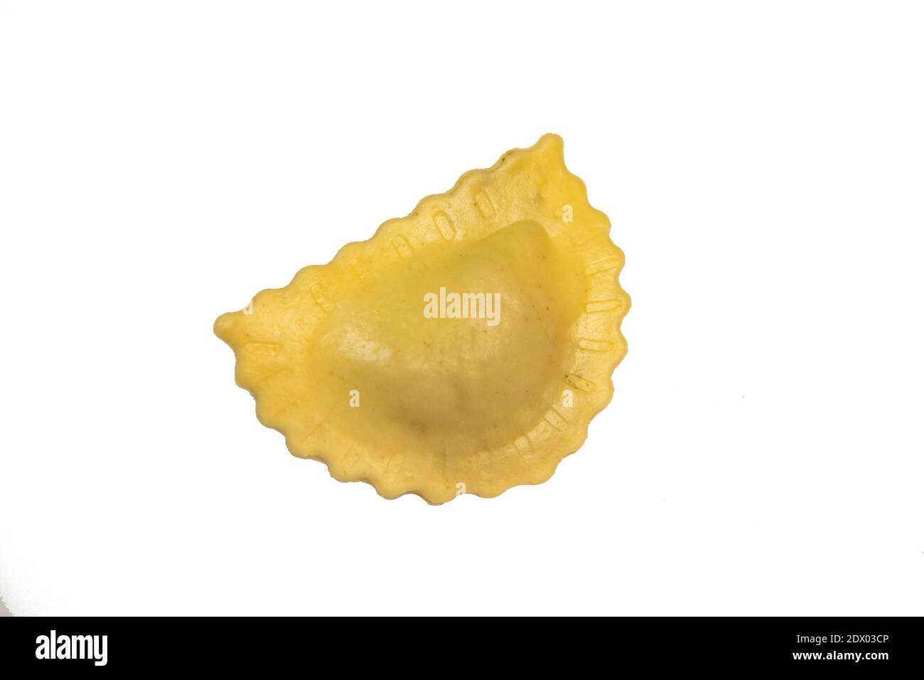Tasty raw ravioli with flour and spinach on white background, process ...