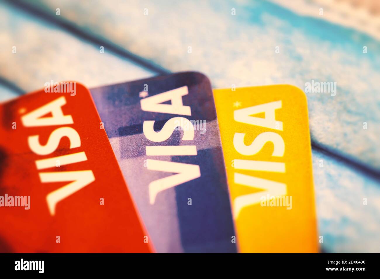 Visa Credit Cards over a protective face mask. A concept of debt during the Covid-19 pandemic Stock Photo