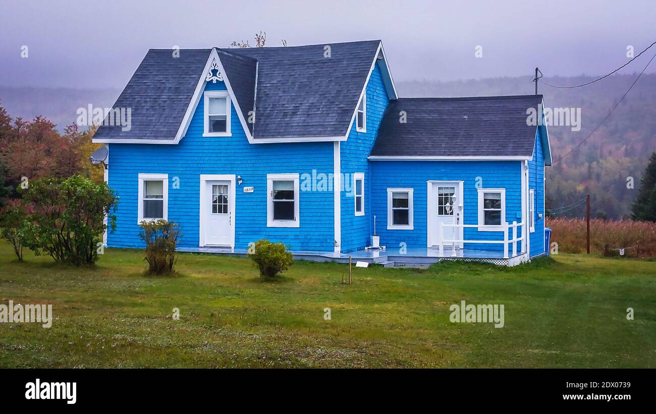 Gaspé Peninsula of Quebec, Canada, Sept 2019, blue house in the Forillon National Park Stock Photo