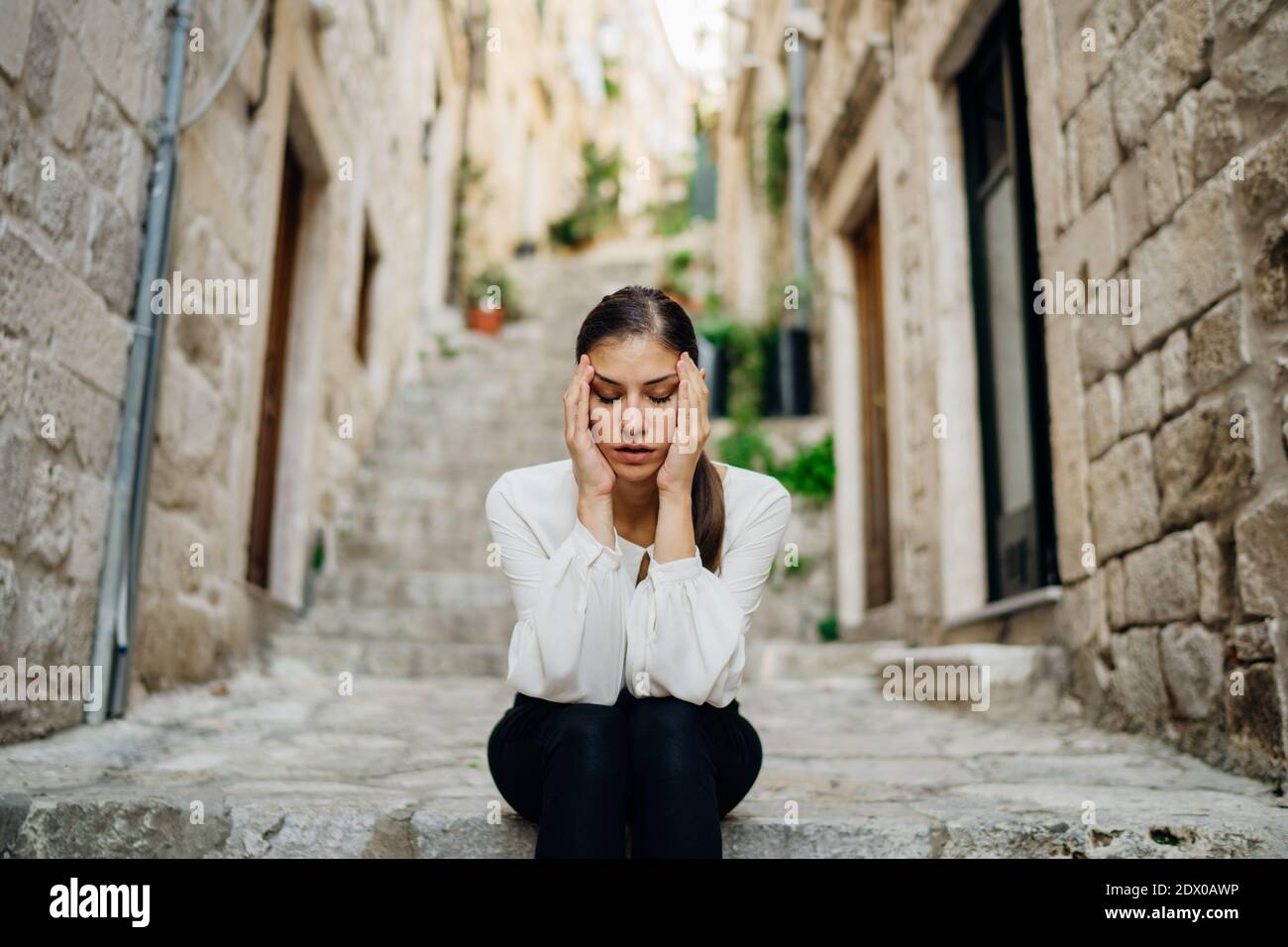 Stressed sad woman in bad mood overthinking problems, having a headache.Mental health problems, depression, anxiety, emotional pain.Relationship probl Stock Photo