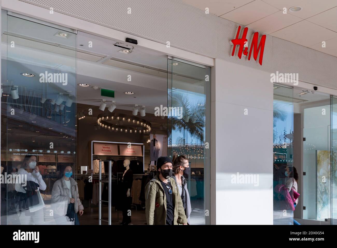 Valencia, Spain. 23rd Dec, 2020. People wearing face masks leaves the H&M  store at the Bonaire shopping center. Credit: Xisco Navarro/SOPA  Images/ZUMA Wire/Alamy Live News Stock Photo - Alamy