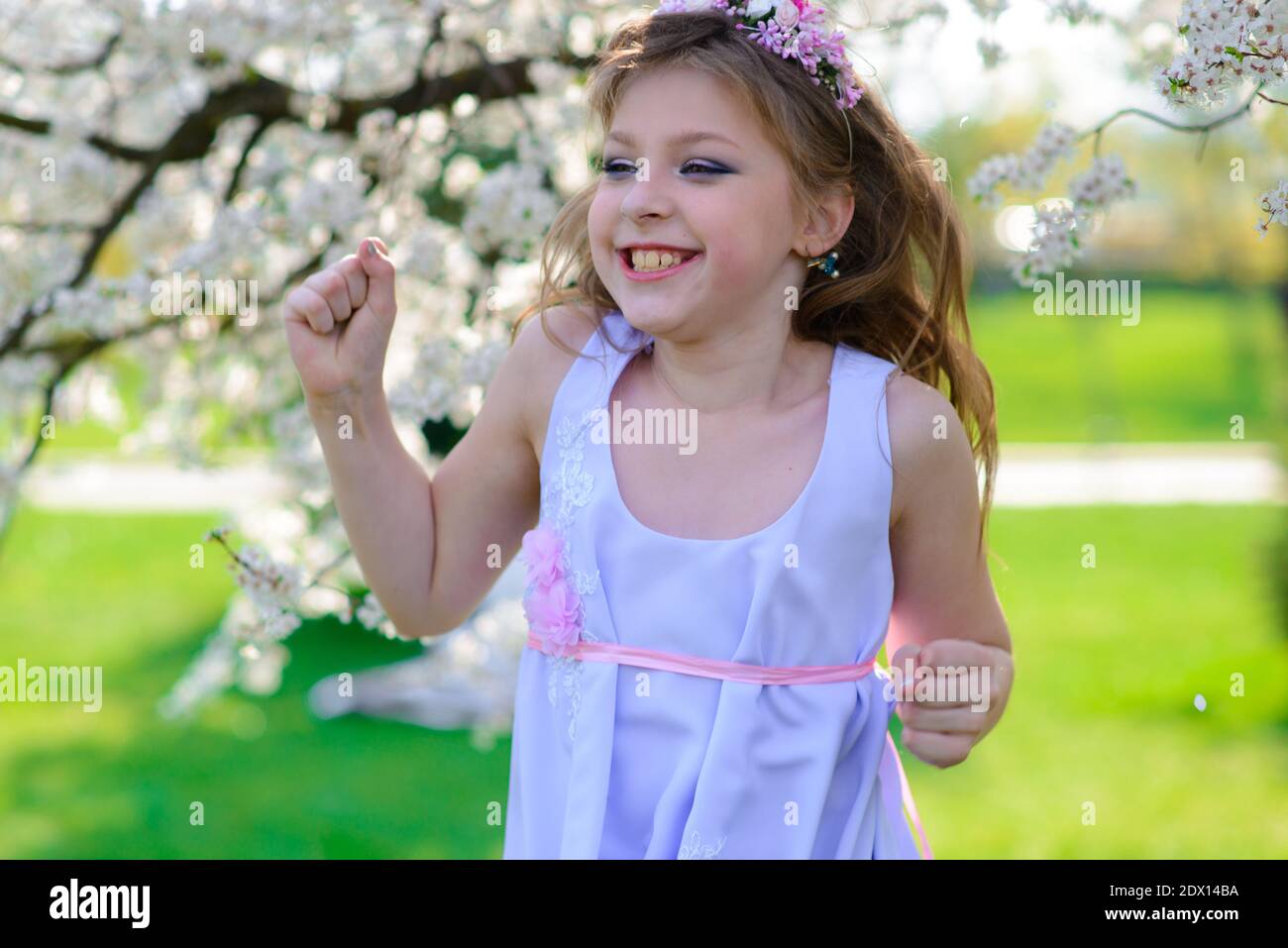 Pretty girl in blooming apple tree garden on beautiful spring day Stock ...