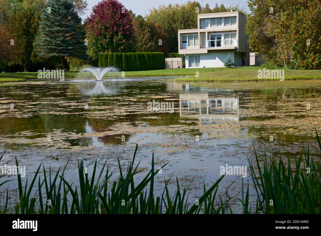 Residential building with a pond in Ontario, Canada Stock Photo Alamy