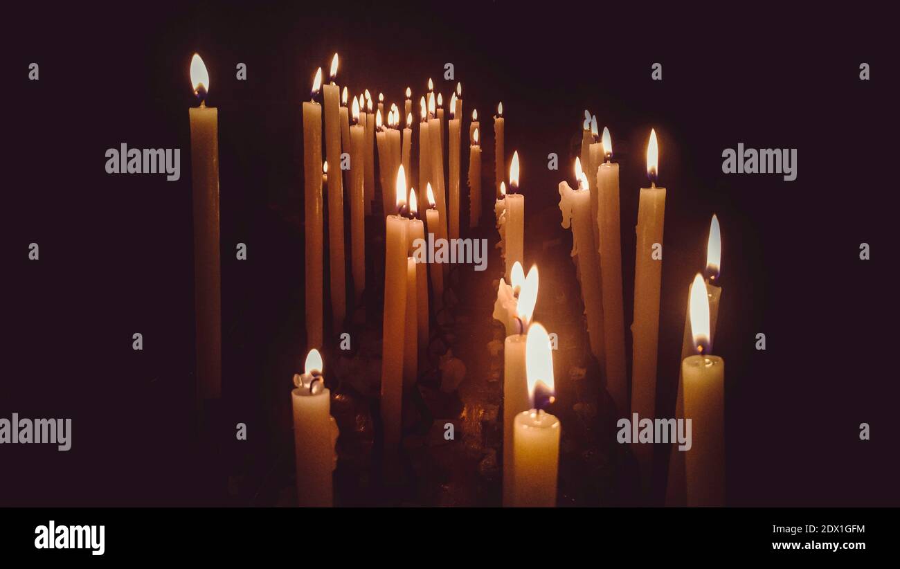 Church Candles Lit With Dramatic Effect Stock Photo