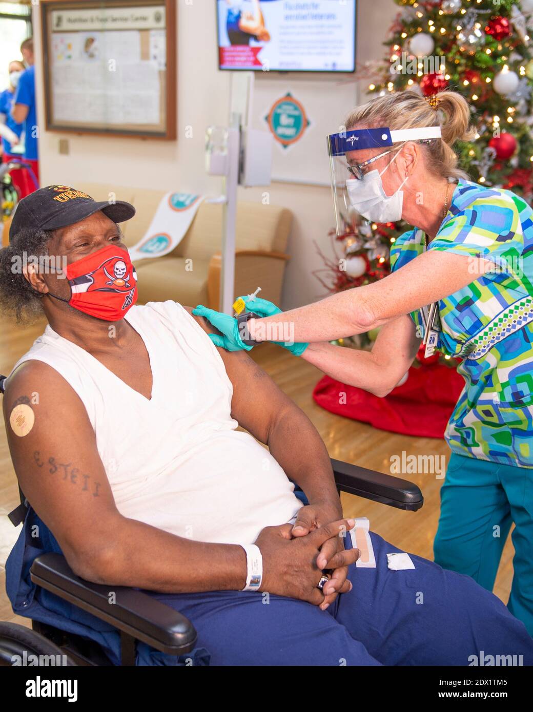 Bay Pines, United States. 22nd Dec, 2020. Marine Corps Veteran Danny James, Sr., resident of the Bay Pines VA Healthcare System Community Living Center, receives a COVID-19 vaccine December 22, 2020 in Bay Pines, Florida. Credit: Planetpix/Alamy Live News Stock Photo