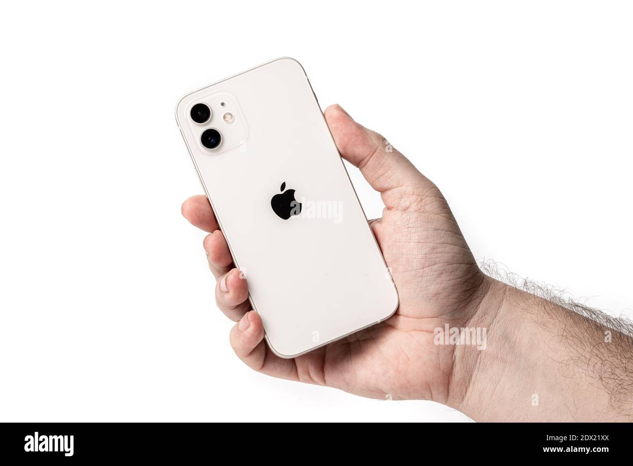 Antalya, Turkey - December 23, 2020: New design iPhone 12 in the white color in the hand of a customer. Stock Photo
