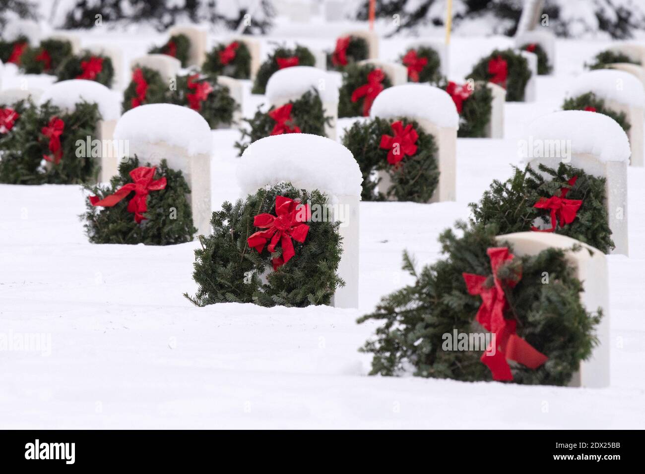 Anchorage, United States Of America. 18th Dec, 2020. Thousands of wreaths on gravesite of a fallen service member on the snow covered Fort Richardson National Cemetery during Wreaths Across America December 18, 2020 near Anchorage, Alaska. Wreaths Across America is to honor and remember fallen service members throughout the holiday season. Credit: Planetpix/Alamy Live News Stock Photo