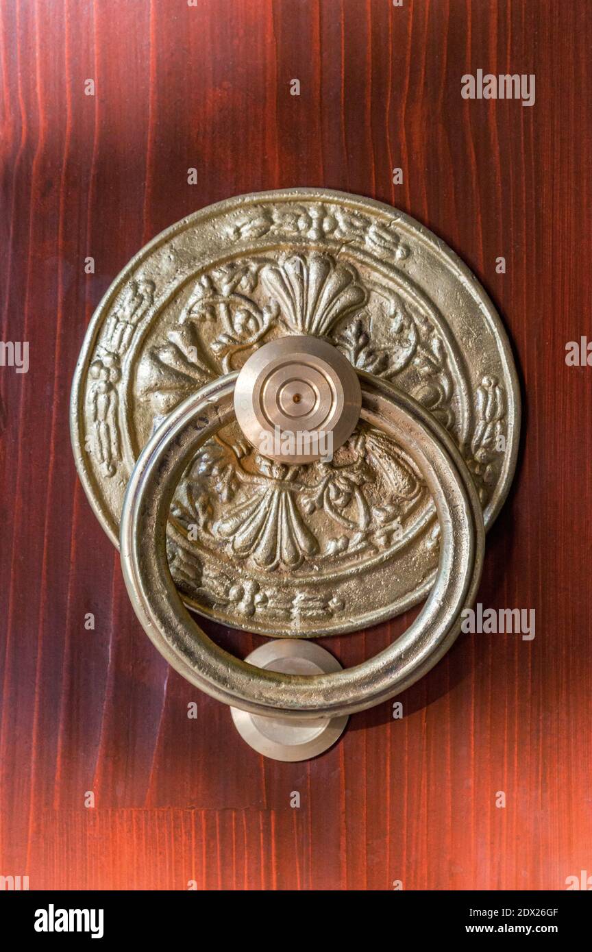 Ancient bronze handle in oriental style on wooden surface Stock Photo Alamy