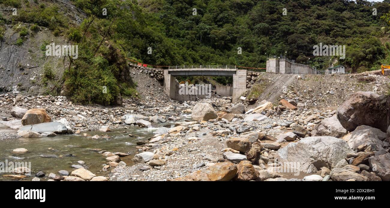 Downstream from a water intake for a hydroelectric plant in a steep river valley near Banos in the Ecuadorian Andes. Stock Photo