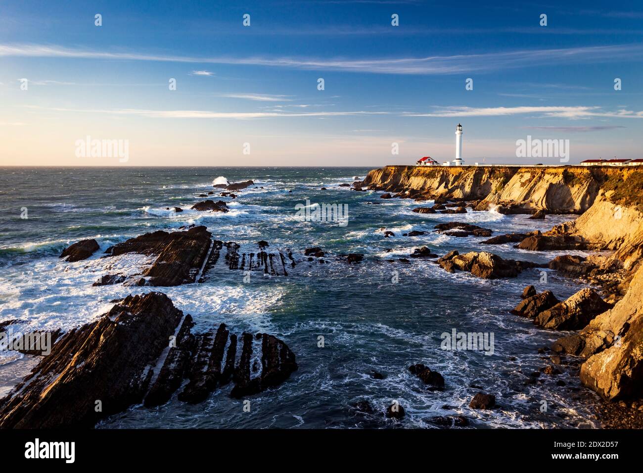 coastal lighthous picture showing the rugged coast and waves Stock Photo