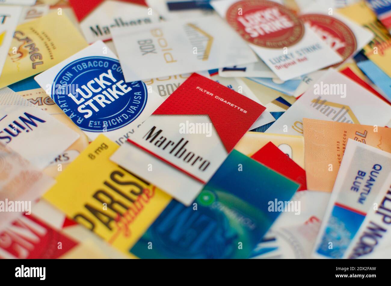 Cadro, Ticino, Switzerland - 28th November 2020 : Cigarettes tags flat lay of many different brands Stock Photo