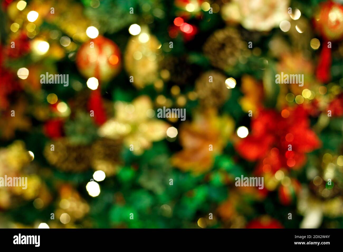 defocused abstract scene background in christmas tree and festive details. Concept of New Year and family festivitie Stock Photo