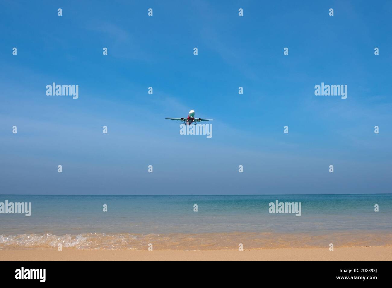 THAILAND, PHUKET, Mai Khao Beach - MARCH 03, 2018: Air Asia plane lands over Mai Khao Beach Stock Photo