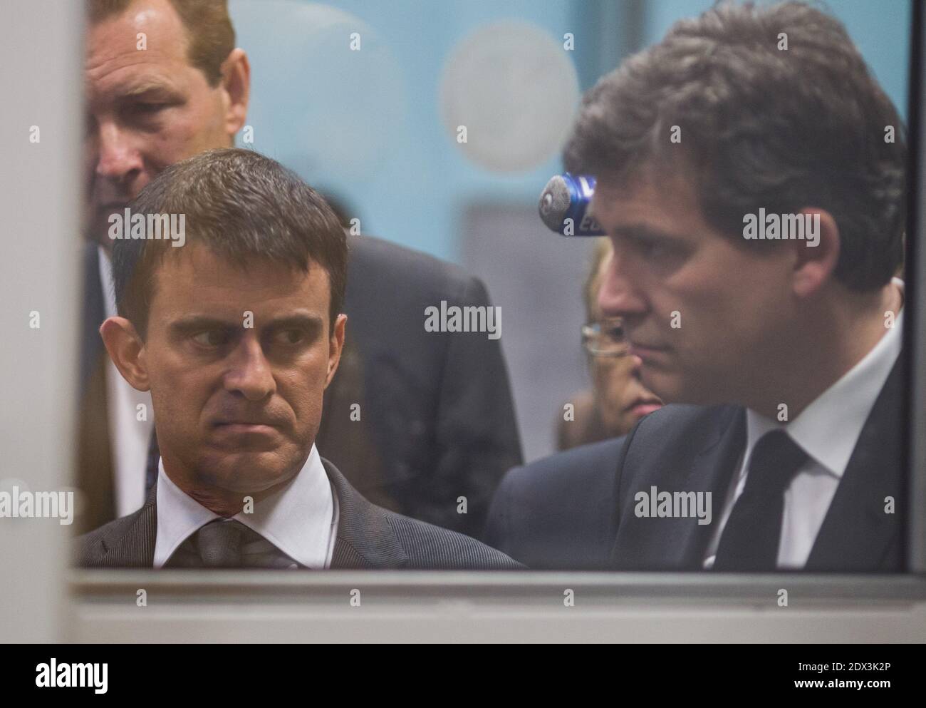 French PM Manuel Valls has submitted the government's resignation to President Francois Hollande and has been asked to form a new cabinet. The government was badly shaken on Sunday by criticism over its handling of the economy by economy minister Arnaud Montebourg. File photo : Arnaud Montebourg and Prime mnnister Manuel Valls visits Straubli plant in Faverges, France wifh the Chairman françois morisse and former nationl assembly president Bernard Accoyer on May 12, 2014. Photos by Vincent Dargent/ABACAPRESS.COM Stock Photo