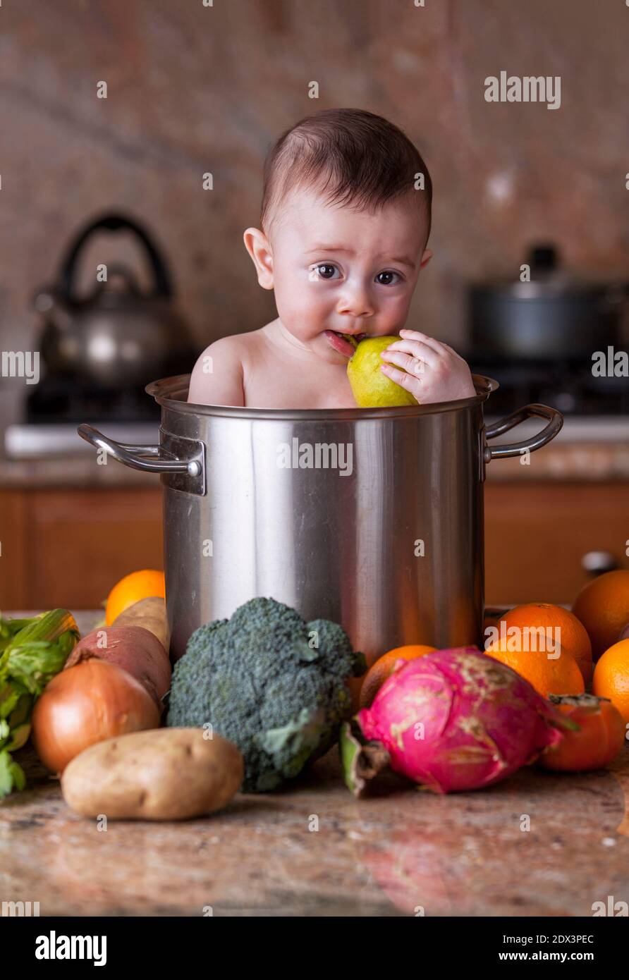 baby with big cooking pot Stock Photo