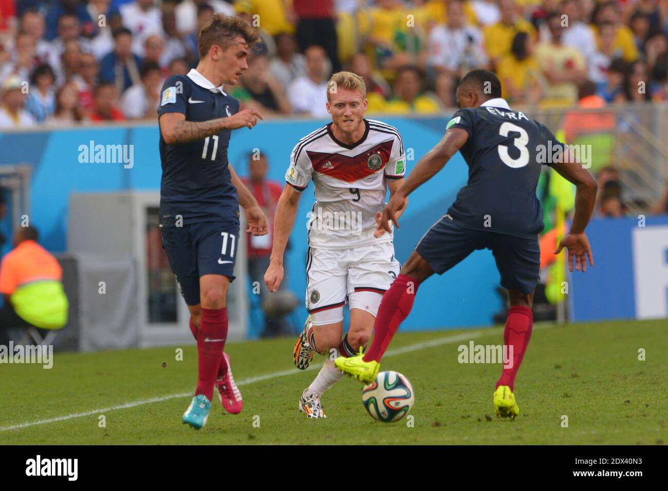 France's Antoine Griezmann and Patrice Evra battling Germany's Andre Schurrle in Soccer World Cup 2014 1/4 of Final round match France vs Germany at Maracana Stadium, Rio de Janeiro, Brazil on July 4th 2014. Germany won 1-0. Photo by Henri Szwarc/ABACAPRESS.COM Stock Photo