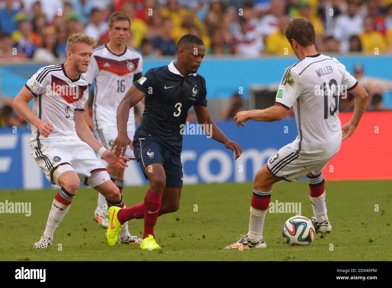 France's Antoine Griezmann and Patrice Evra battling Germany's Andre Schurrle in Soccer World Cup 2014 1/4 of Final round match France vs Germany at Maracana Stadium, Rio de Janeiro, Brazil on July 4th 2014. Germany won 1-0. Photo by Henri Szwarc/ABACAPRESS.COM Stock Photo